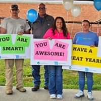 Employees Cheer on Local Students for Back-to-School Warm Welcome